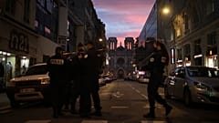 Police work behind a restricted zone near the Notre Dame church in Nice, southern France, after a knife attack took place on Thursday, Oct. 29, 2020. 