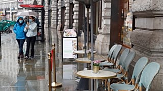 People wearing masks to help prevent the spread of the coronavirus walk along Regent Street, one of the main shopping streets in London, Thursday, Oct. 29, 2020.