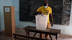 A man casts his vote during presidential election in Abidjan, Ivory Coast, Saturday, Oct. 31, 2020