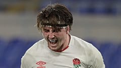 England's Tom Curry celebrates after scoring a try during the Six Nations rugby union international match between Italy and England at the Olympic Stadium in Rome, Italy,
