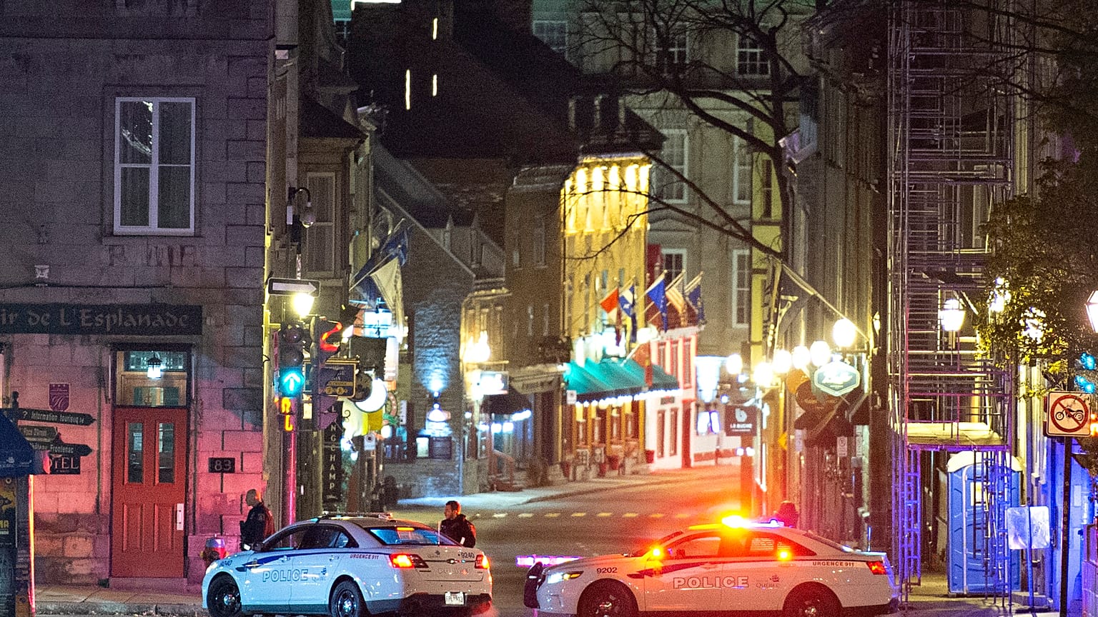 Police cars block the Saint-Louis Street near the Chateau Frontenac early Sunday, Nov. 1, 2020 in Quebec City