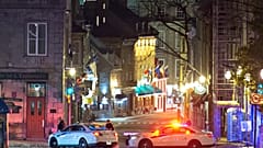 Police cars block the Saint-Louis Street near the Chateau Frontenac early Sunday, Nov. 1, 2020 in Quebec City