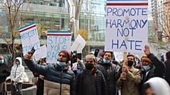 Canadian muslims holding signs