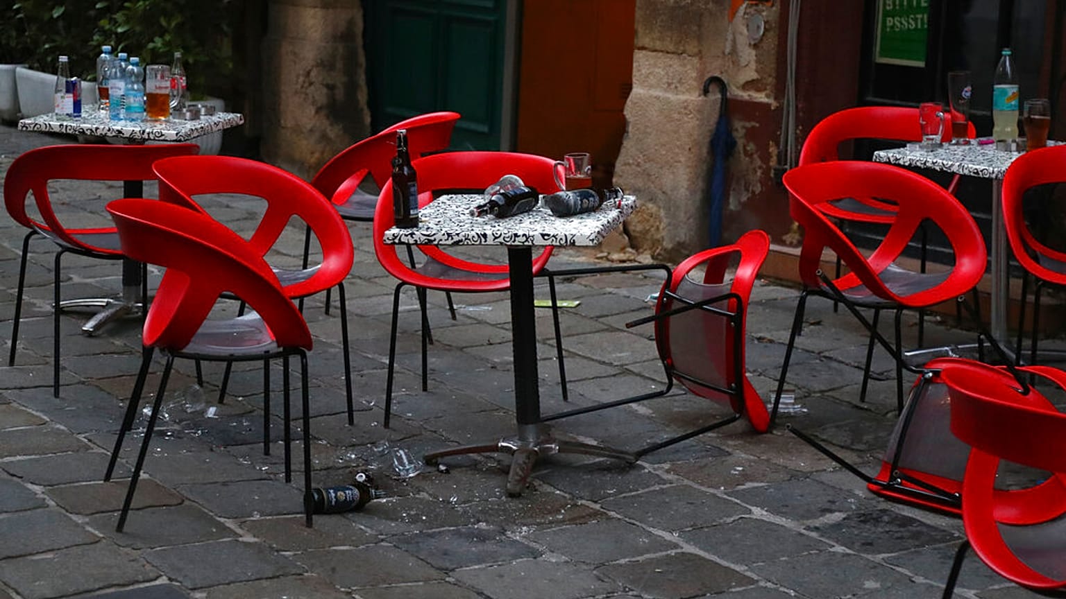 Chairs lie on the ground at the crime scene in a bar in Vienna, Austria, Tuesday, Nov. 3, 2020. 
