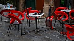 Chairs lie on the ground at the crime scene in a bar in Vienna, Austria, Tuesday, Nov. 3, 2020. 