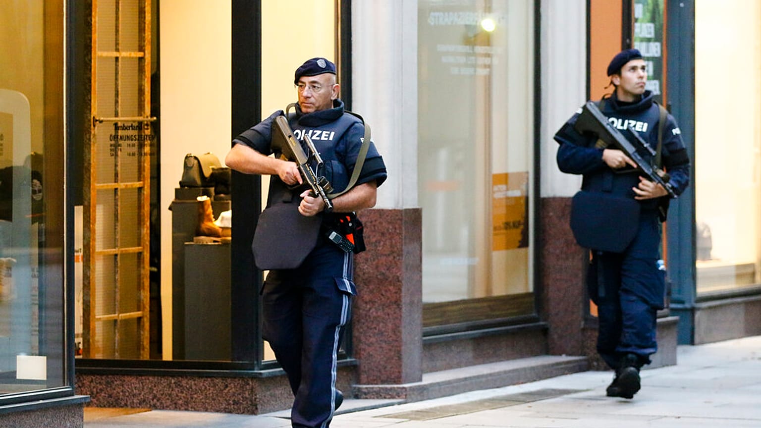 After a shooting armed police officers patrol on a street at the scene in Vienna, Austria, Tuesday, Nov. 3, 2020.