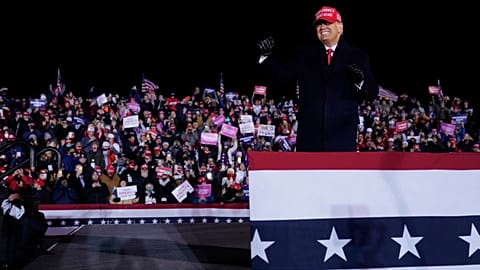 President Donald Trump on stage after a campaign rally at Gerald R. Ford International Airport, early Tuesday, Nov. 3, 2020, in Grand Rapids, Mich. (AP Photo/Evan Vucci)
