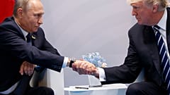 In this July 7, 2017, file photo, US President Donald Trump shakes hands with Russian President Vladimir Putin at the G20 Summit in Hamburg