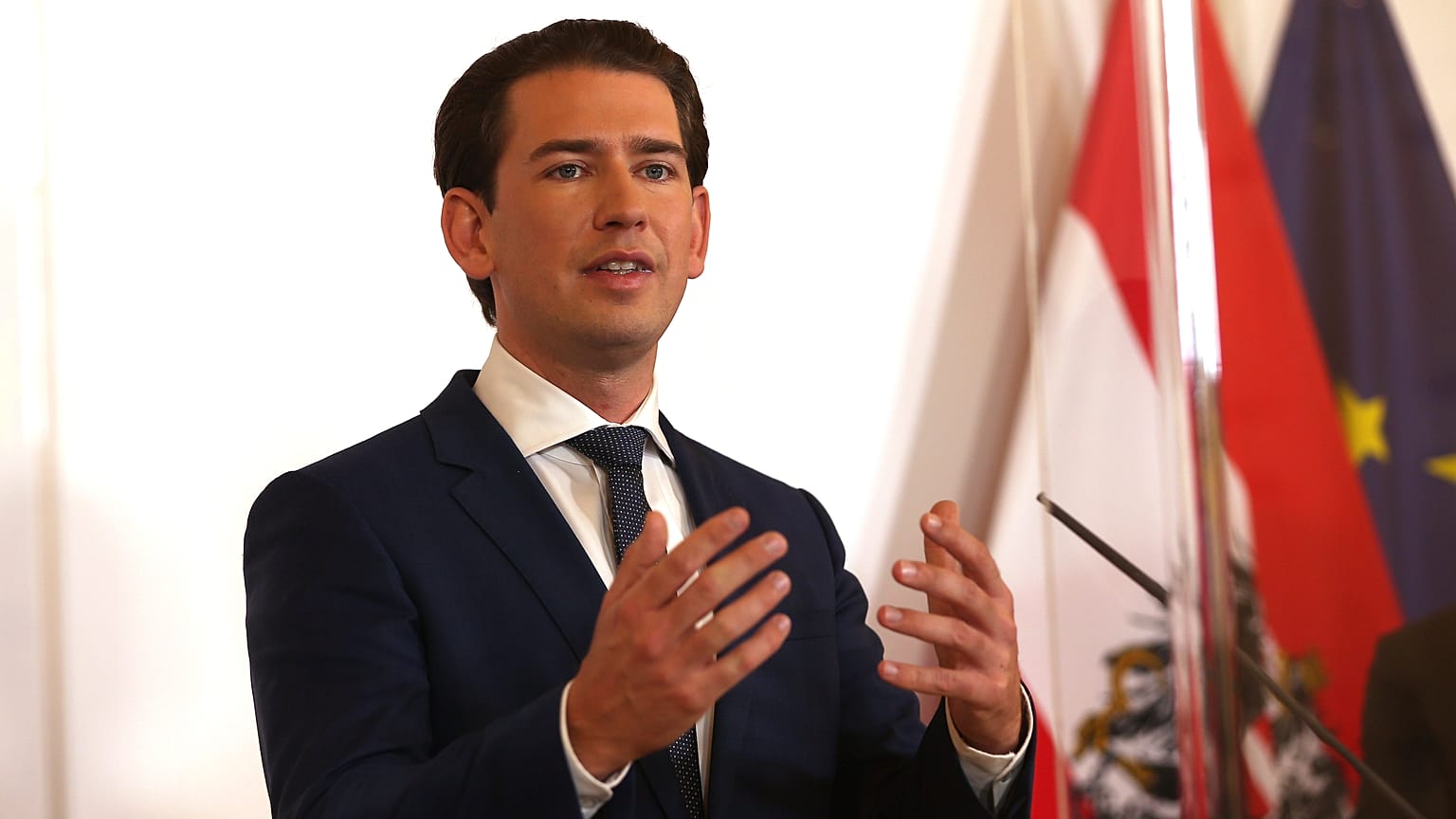 Austrian Chancellor Sebastian Kurz speaks during a press conference behind plexiglass shields at the federal chancellery in Vienna, Austria, Saturday, Oct. 31, 2020.