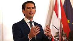 Austrian Chancellor Sebastian Kurz speaks during a press conference behind plexiglass shields at the federal chancellery in Vienna, Austria, Saturday, Oct. 31, 2020.