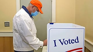Republican U.S. Sen. Lindsey Graham marks his ballot electronically while voting in the general election in Seneca, South Carolina.