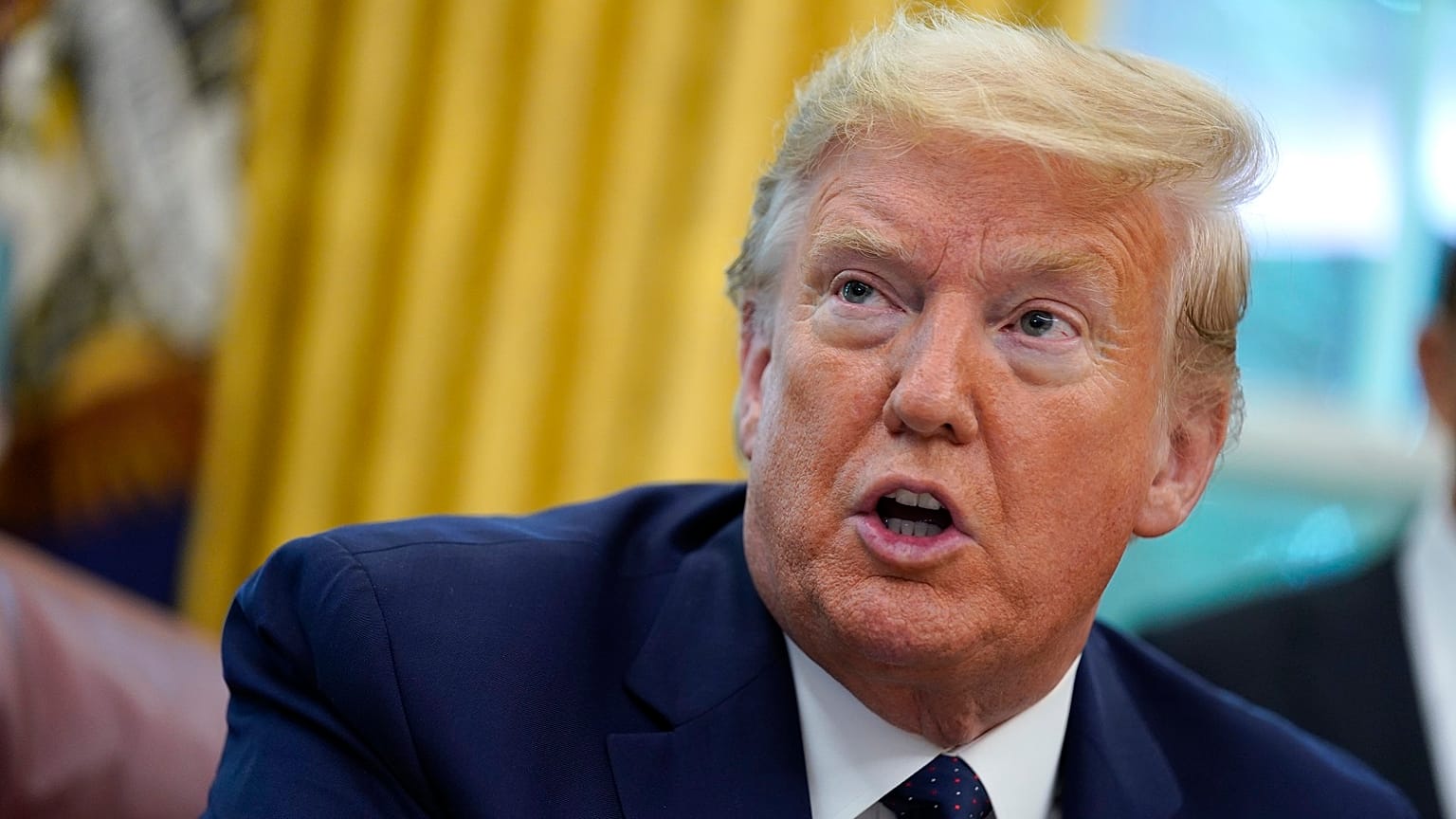 President Donald Trump speaks as he receives a briefing on the 2020 hurricane season in the Oval Office of the White House in Washington.
