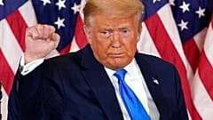 President Donald Trump pumps his fist after speaking in the East Room of the White House, early Wednesday, Nov. 4, 2020, in Washington.