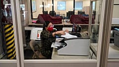 A county election worker scans ballots at a tabulating area at the Clark County Election Department, Wednesday, Nov. 4, 2020, in Las Vegas.