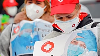 Health care workers demonstrate in "eshaustion protest" in Romania's capital.