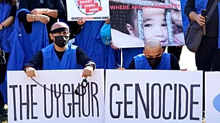 Members of the Uyghur American Association rally in front of the White House, Thursday, Oct. 1, 2020.
