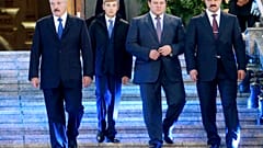 In this photo taken Friday, Oct. 2, 2015, Belarusian President Alexander Lukashenko, left, with his sons, from right, Viktor, Dmitry and Nikolai, walk after a church service.