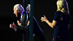 President-elect Joe Biden reacts on stage with Jill Biden after speaking, Nov. 7, 2020, in Wilmington, Del.
