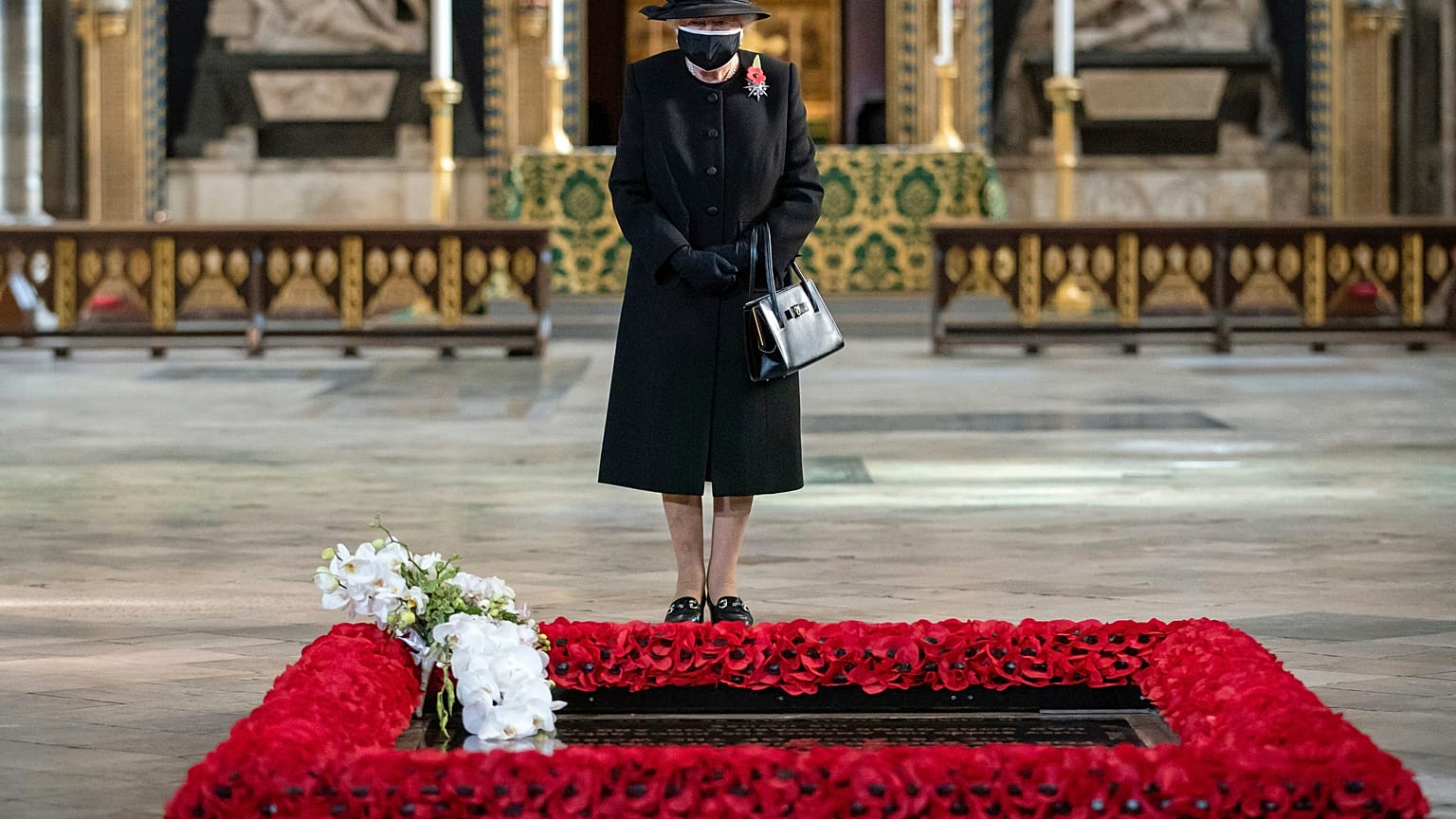 Britain's Queen Elizabeth II attends a ceremony to mark the centenary of the burial of the Unknown Warrior, in Westminster Abbey, London, Wednesday, Nov. 4, 2020