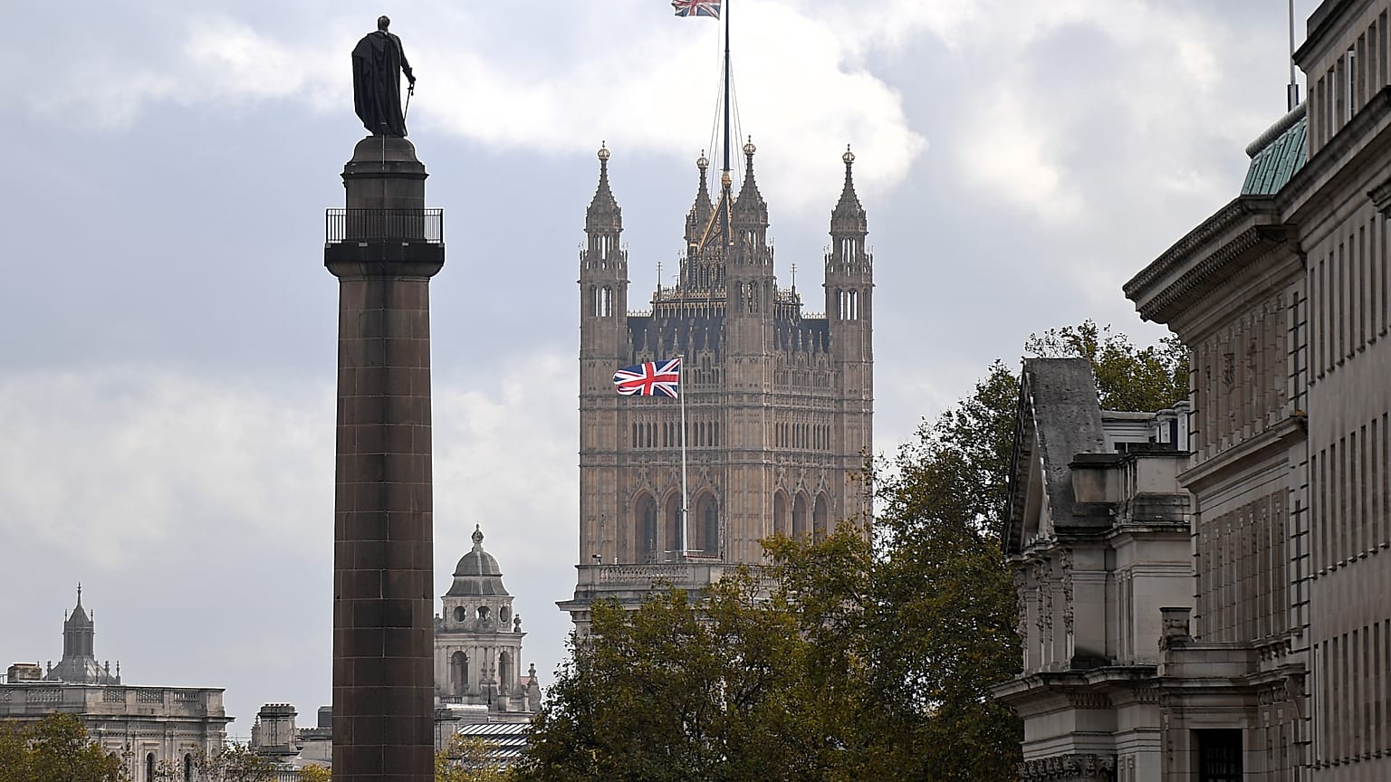 A Union flag flies atop the the Victoria Tower at Britain's Houses of Parliament, incorporating the House of Lords and the House of Commons, in London on October 20, 2020. 