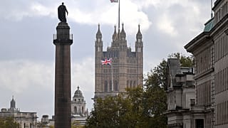 A Union flag flies atop the the Victoria Tower at Britain's Houses of Parliament, incorporating the House of Lords and the House of Commons, in London on October 20, 2020. 