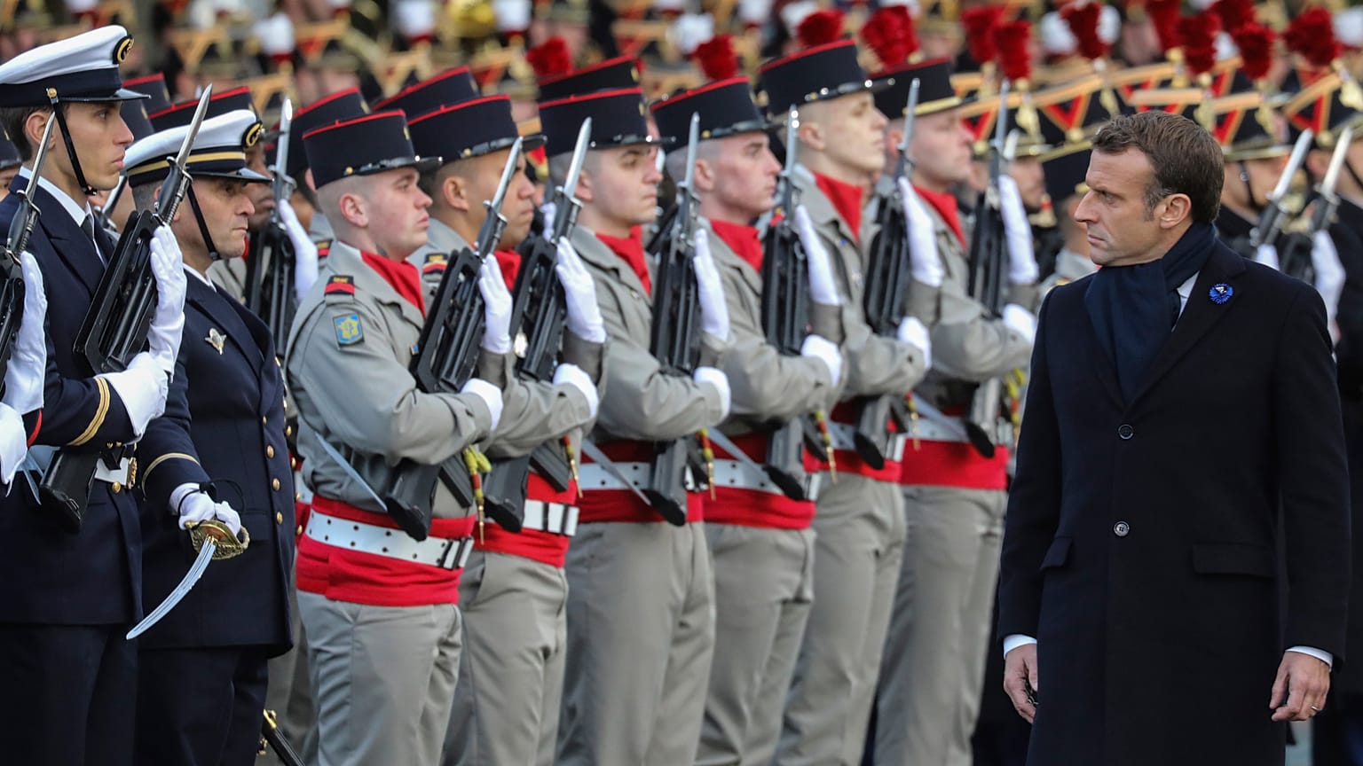 French President Emmanuel Macron reviews the troops as he inaugurates a memorial for soldiers fallen in foreign conflicts, Monday Nov. 11, 2019 in Paris.