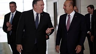 Turkey's Foreign Minister Mevlut Cavusoglu, right, and U.S. Secretary of State Mike Pompeo 