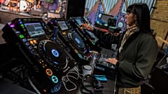 A DJ prepares her decks at a Berlin club back in March 2020