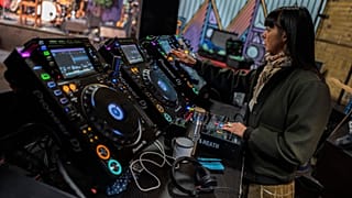 A DJ prepares her decks at a Berlin club back in March 2020