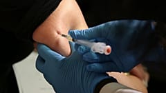 In this March 27, 2019 file photo, a woman receives a measles, mumps and rubella vaccine at the Rockland County Health Department in Pomona, N.Y.