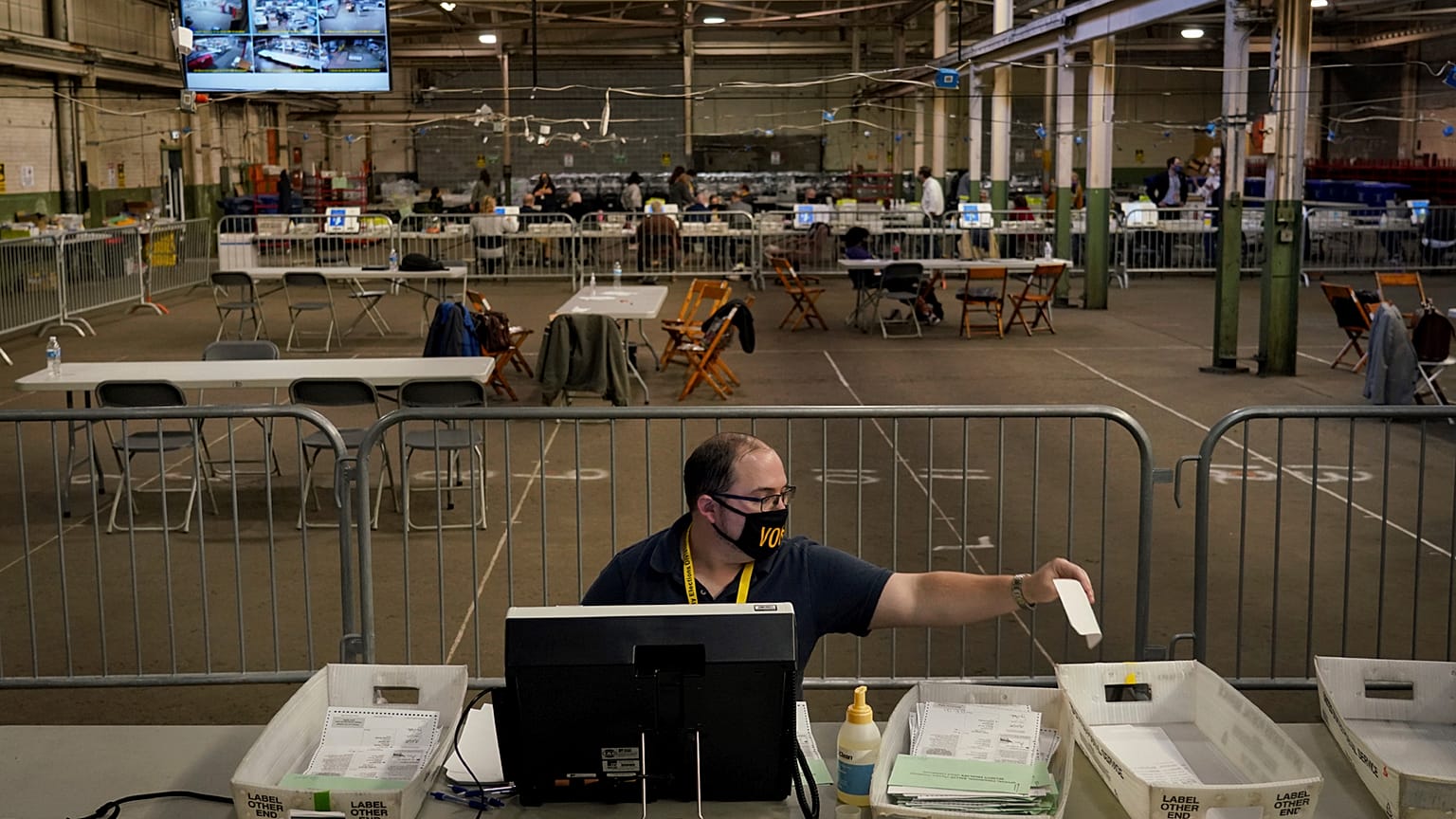 Members of the Allegheny County Return Board process the remaining absentee and mail-in Allegheny County ballots, Thursday, Nov. 12, 2020, on the North Side in Pittsburgh.