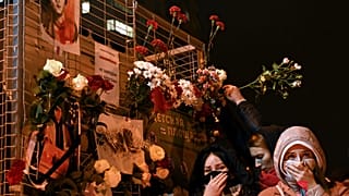 People have laid flowers to pay tribute at 'The Square of Changes' in Minsk.