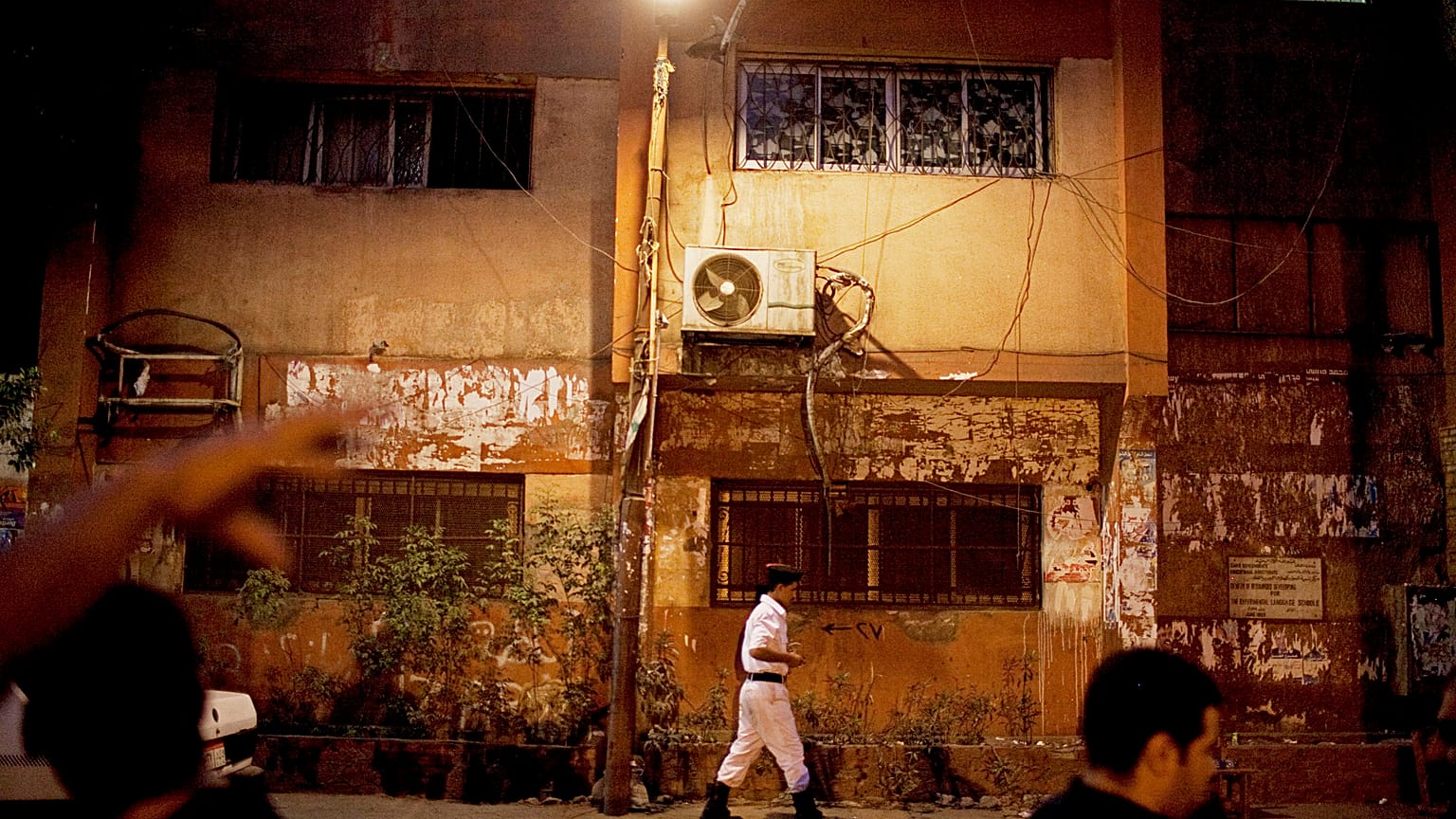 An Egyptian police officer stands outside a polling station in the Abdeen area of Cairo, Egypt on Sunday, June 17, 2012