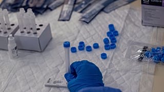 A Madrid Emergency Service (SUMMA) health workers conducts a rapid antigen test for COVID-19 in the southern neighbourhood of Vallecas in Madrid, Spain, Sept. 29, 2020