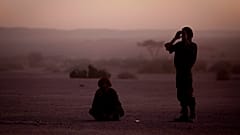 FILE - In this Feb.27, 2011 file photo, pro-independence Polisario Front rebel soldiers pray after sunset in the Western Sahara village of Tifariti.