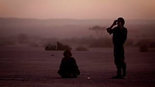 FILE - In this Feb.27, 2011 file photo, pro-independence Polisario Front rebel soldiers pray after sunset in the Western Sahara village of Tifariti.
