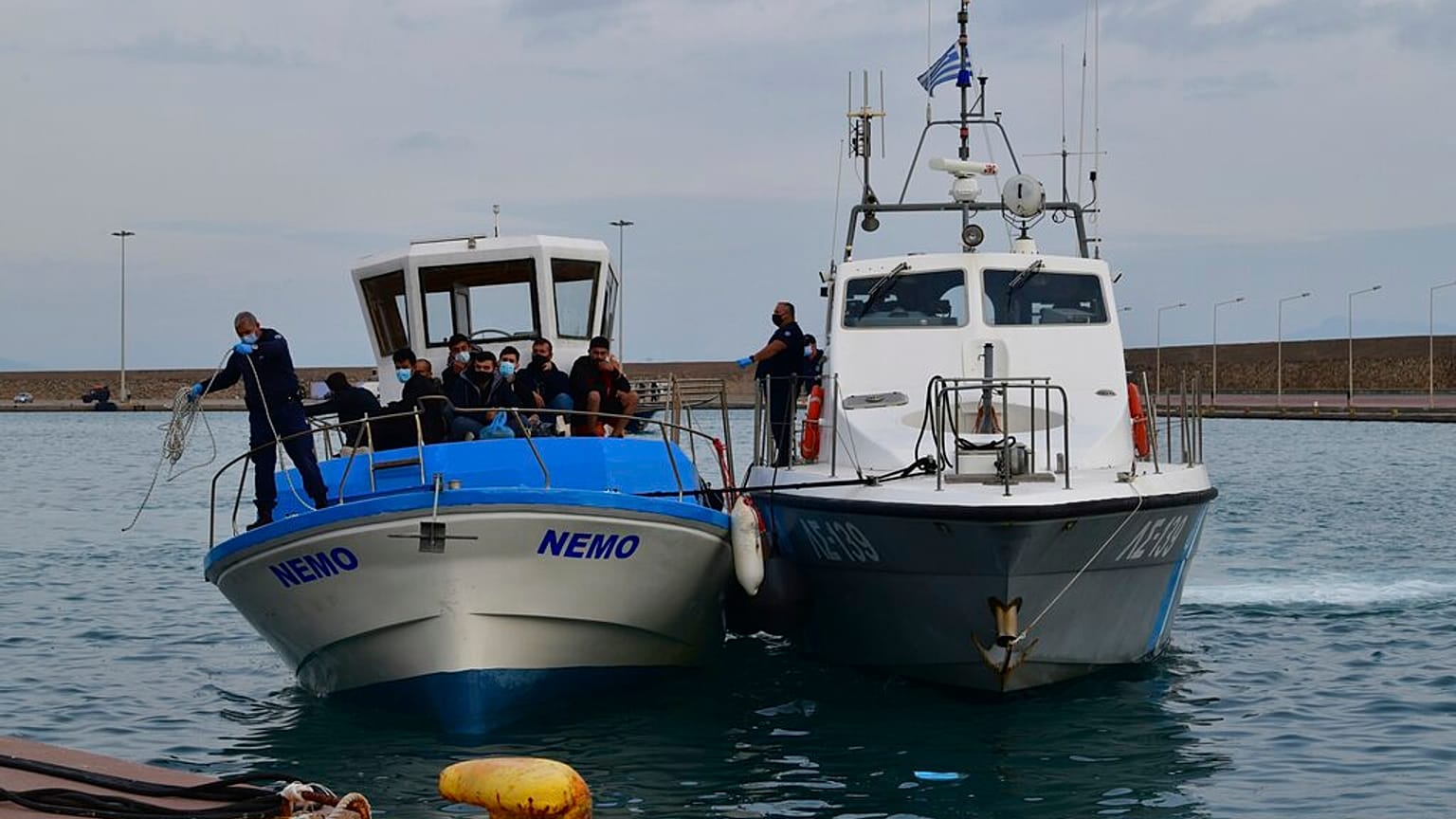 A vessel with migrants arrive after an operation by the Greek Coast guard