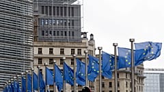 European Union flags flap in the wind at EU headquarters in Brussels, Wednesday, Oct. 9, 2019.