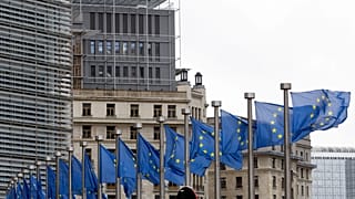 European Union flags flap in the wind at EU headquarters in Brussels, Wednesday, Oct. 9, 2019.