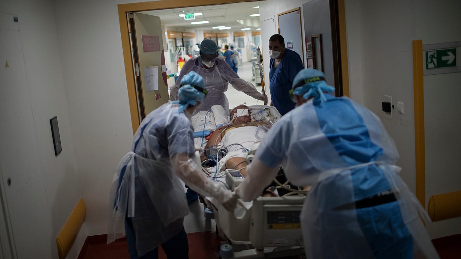 A COVID-19 patient is transferred to the main ICU at the La Timone hospital in Marseille on Thursday, Nov. 12, 2020. 