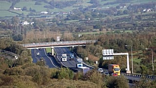 Motorists on the M1 motorway crossing the Irish border near Jonesborough, Republic of Ireland, looking across the border into Northern Ireland, Wednesday, Oct. 16, 2019.
