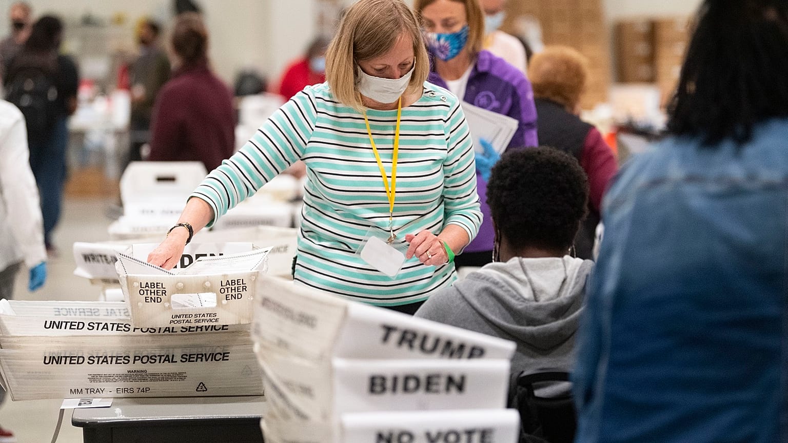 An election worker in Georgia sorts through ballots during a Cobb County hand recount of presidential votes on Sunday, November 15, 2020.