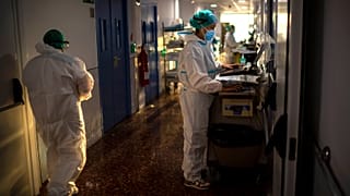 Nurse Marta Fernandez works at the COVID-19 ward at the hospital del Mar in Barcelona, Spain, Wednesday, November 18, 2020.