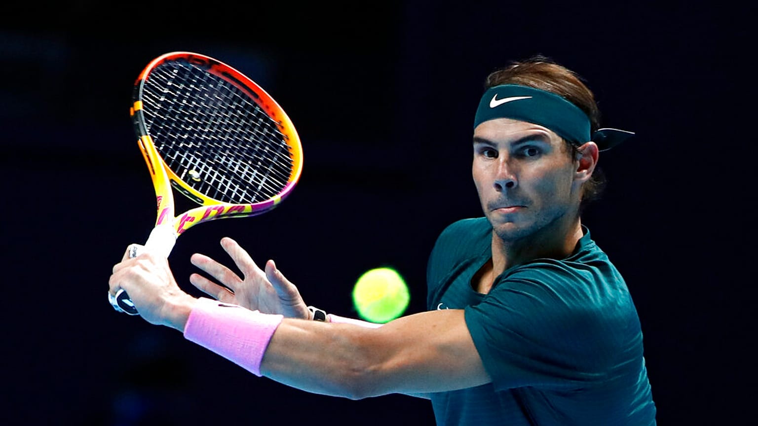 Rafael Nadal of Spain returns the ball to Stefanos Tsitsipas of Greece during their tennis match at the ATP World Finals.
