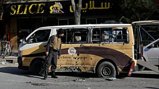 Afghan security checks a car destroyed in a rocket attack in Kabul, Afghanistan,Saturday, November 21, 2020.