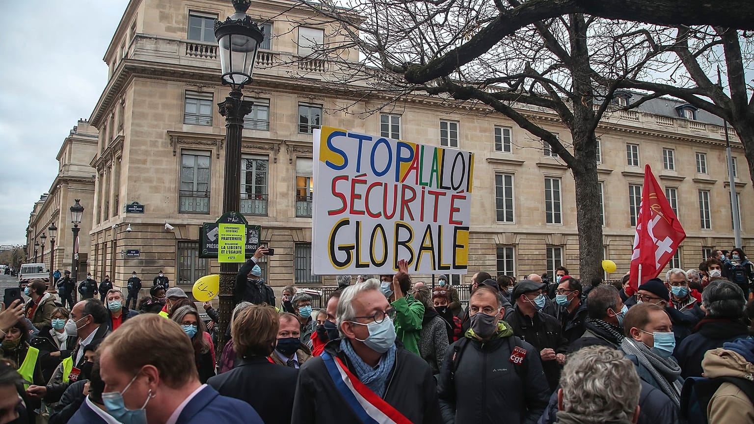 Demonstrators wearing masks stage a protest by the National Assembly against the security bill in Paris, Tuesday, November 17, 2020.