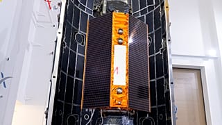 In this Nov. 3, 2020 photo, provide by the European Space Agency, the Sentinel-6 satellite is placed inside the upper stage of a Falcon 9 rocket.