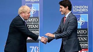 UK Prime Minister Boris Johnson (L) and Canadian Prime Minister Justin Trudeau during official arrivals for a NATO leaders meeting on Dec. 4, 2019.