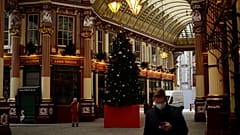 A Christmas tree stands on display in the middle of Leadenhall Market where all the non-essential shops are temporarily closed, during England's second coronavirus lockdown.