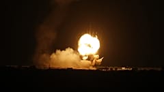 Flames are seen following an Israeli air strike in the town of Khan Yunis, in the southern Gaza Strip, early on November 22, 2020. 